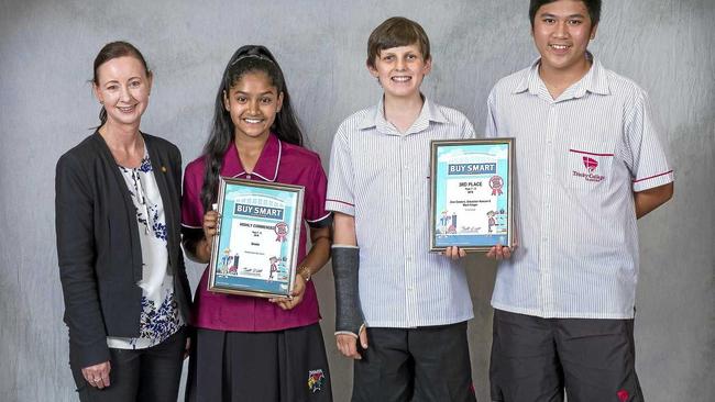 BE SMART: Minister for Justice Yvette D'Ath with Buy Smart Competition award recipients Drishti (Toolooa State High School), Sebastian Hurcum and Zion Cordero (Trinity College). Picture: Waddington Photography