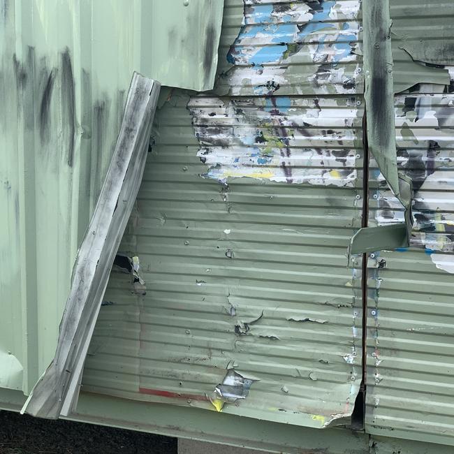 The heavily damaged building at the centre of a gang-related attack in Brisbane's north.