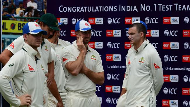 Steve Smith (L) waits with teammates during the award ceremony after the final Test.