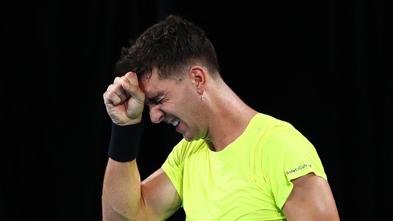 SYDNEY, AUSTRALIA - MARCH 04: Thanasi Kokkinakis of Australia reacts after losing a point in his singles match against Marton Fucsovics of Hungary during the 2022 Davis Cup Qualifier between Australia and Hungary at Ken Rosewall Arena on March 04, 2022 in Sydney, Australia. (Photo by Mark Metcalfe/Getty Images)