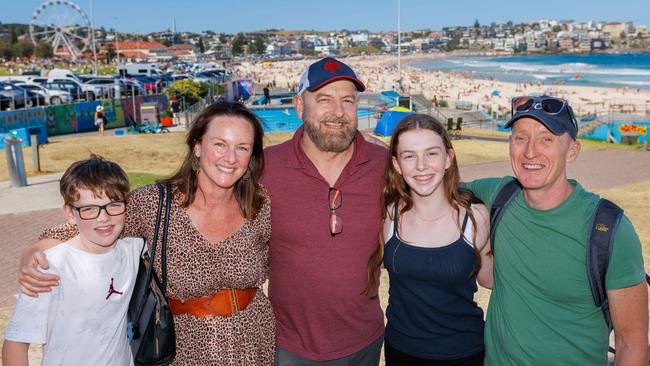 Clovelly resident Luke Worthington (centre) with his family Edward, 9, Catherine, and Ruby, 12, and their friend Bobby Murdoch at Bondi Beach. Photo: Max Mason-Hubers