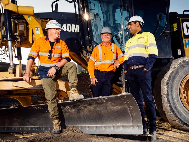 Workers, from left grader operator Adam Snushall, excavator driver Chris Donnelly and construction engineer Nischal Kaushik at the road works on The Northern Road at Harrington Park. Picture: Jonathan Ng