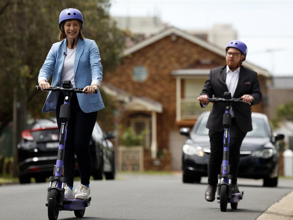 Transport Minister Jo Haylen and Daily Telegraph journalist James O'Doherty ride electric scooters in Kogarah, ahead of the government’s decision to make them legal. Picture: Jonathan Ng