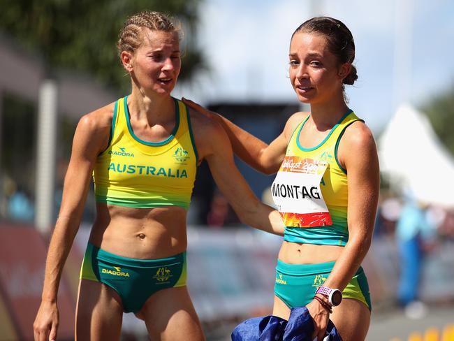 Gold Medalist, Jemima Montag of Australia consols the disqualified Claire Tallent.