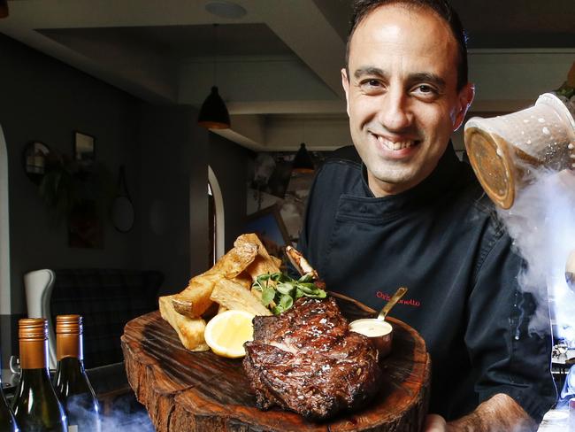 MPD Steak Kitchen back open. Executive Chef Chris Bonello with a signature Tomahawk steak, and Venue Manager Marcus Fabian with an espresso martini.  Picture: David Caird