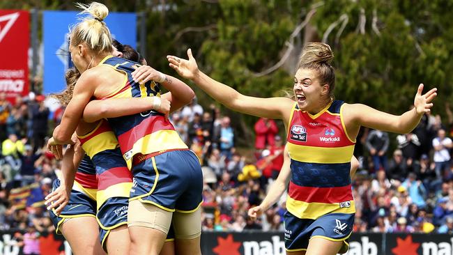 Erin Phillips gets hugged as Ebony Marinoff comes in to help celebrate. Picture: Sarah Reed