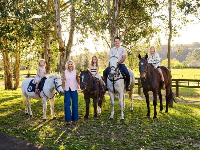 EMBARGO FOR WISH MAGAZINE. 04 OCTOBER 2024. For Elisha Hopkinson, Chief Executive of Australian heritage brands Sportscraft, Jag and Saba, family time, much of it spent on their beloved NSW Polo farm, provides a restorative change of pace. Elisha Hopkinson and her husband Sam, on Pistol, with their three daughters, from left, Milla, 4, on Stormy, Imogen, 8, on Boomer, and Sienna, 10, on Nadal, at their farm in Richmond, on Sydneys rural outskirts. Elisha and Sam wear Sportscraft throughout. Photo: Hugh Stewart