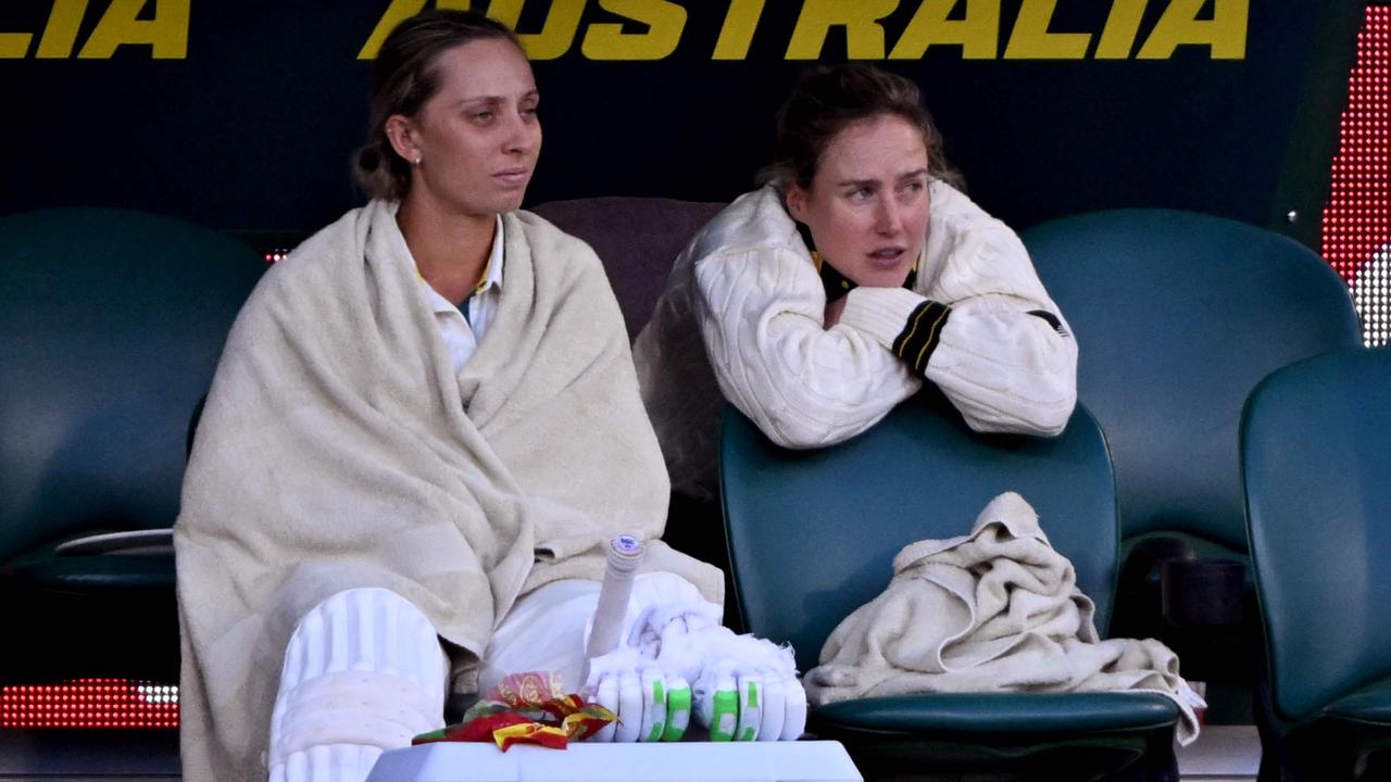 Ellyse Perry (R) made an unusual cameo on day three. (Photo by William WEST / AFP