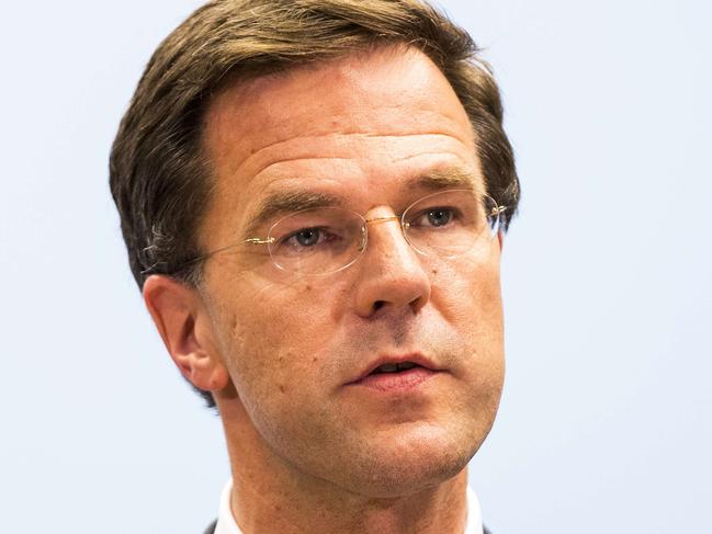 Dutch Prime minister Mark Rutte adresses the media with the latest updates on the transportation by train from Torez to Kharkiv of the bodies of victims from flight MH17, on July 21, 2014 in The Hague. Western powers on July 21 ratcheted up the pressure on Moscow over the Malaysian plane disaster, as a train loaded with some 280 bodies was finally allowed to leave a rebel-held station four days after the jet crashed in strife-torn east Ukraine. The train carrying bodies from flight MH17 could take 10-12 hours to reach the Ukrainian city of Kharkiv after passing through rebel-held territory, Rutte said. AFP PHOTO / ANP / VALERIE KUYPERS ** Netherlands Out **