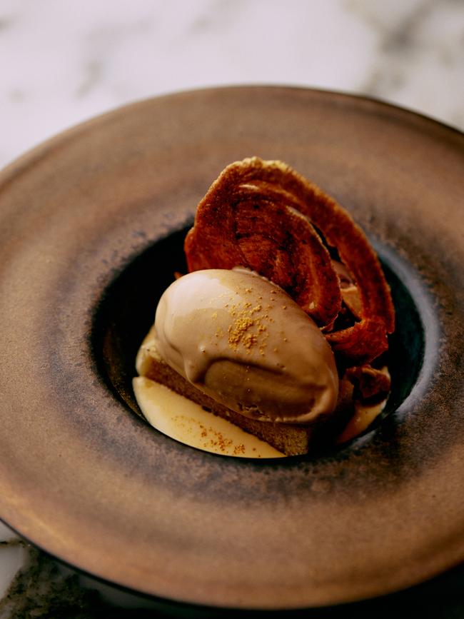 One of Faro Restaurant’s desserts from their Nouveau Faux, Bordeaux, menu – the Almond croissant – which includes brown butter financier, croissant ice cream, warm chocolate cream, amaretto anglaise, cinnamon arlette and toasted almonds. Picture: Jesse Hunniford/ Image courtesy Museum of Old and New Art