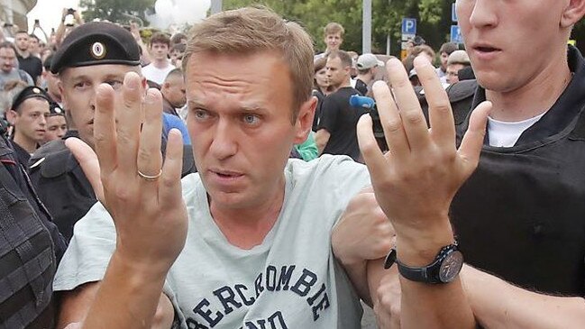 Russian opposition leader Alexei Navalny is led away by police. Picture: Supplied