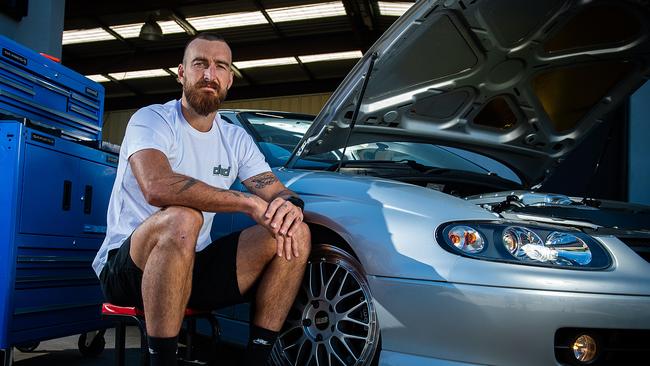 Charlie Dixon with his 2003 Holden Monaro at the Welland garage where he restores cars. Picture: Tom Huntley