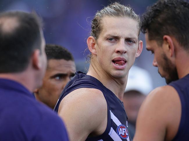 PERTH, WESTERN AUSTRALIA - MAY 21:  Nat Fyfe listens as Ross Lyon, Senior Coach of the Dockers, addresses the players at the quarter time breakduring the round nine AFL match between the Fremantle Dockers and the Carlton Blues at Domain Stadium on May 21, 2017 in Perth, Australia.  (Photo by Will Russell/AFL Media/Getty Images)