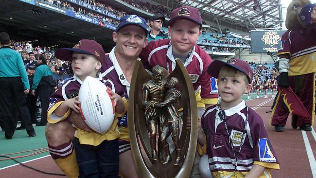 Kevin Walters with his children Jett (3), Jack (8) and Billy (6) after the 2000 grand final. Picture: Brett Faulkner