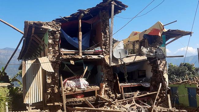 TOPSHOT - Damaged houses lie in ruins, in the aftermath of an earthquake at Pipaldanda village of Jajarkot district on November 4, 2023. At least 132 people were killed in an overnight earthquake that struck a remote pocket of Nepal, officials said on November 4, as security forces rushed to assist with rescue efforts. (Photo by Balkumar Sharma / AFP)