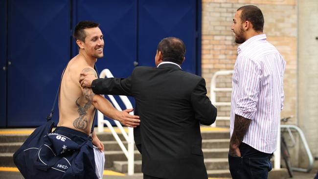 Blake Ferguson (R), with manager Sam Ayoub (C), bumps into Mitchell Pearce (L) at Roosters training. Picture: Brett Costello