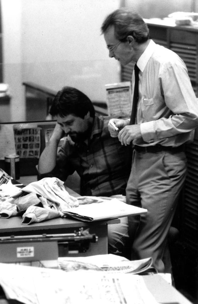 Editor-in-chief Les Carlyon (standing) and editor Neil Mitchell checking over the final edition of the Saturday Herald in 1986.