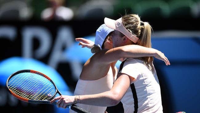 Elina Svitolina of Ukraine (right) embraces countrywoman Marta Kostyuk after their third round match. Photo: AAP