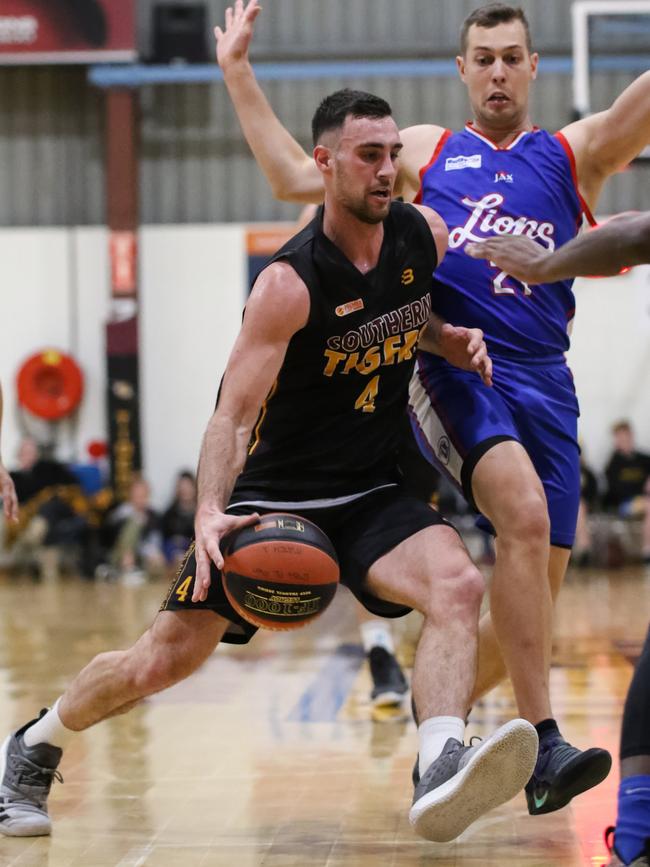 Sam Johns gets past a defender playing Premier League basketball for Southern. Picture: Rod Patterson