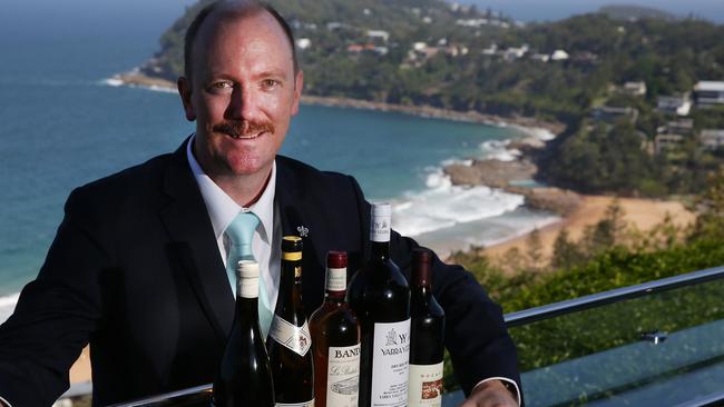 Jonah’s sommelier Luke Collard with a selection of wines from Jonah's cellar. Picture: Martin Lange