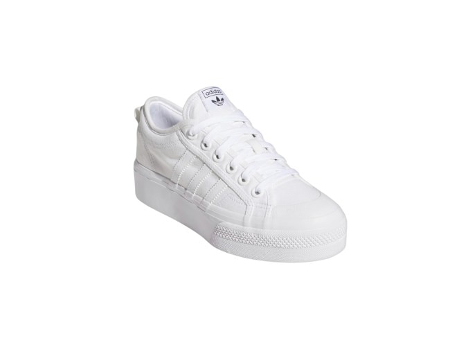 These white sneakers are made from recycled polyester and 50% parley ocean plastic..