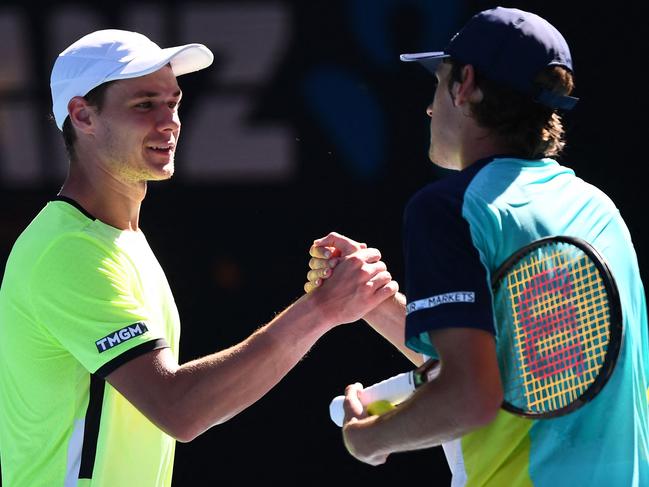 Poland’s Kamil Majchrzak congratulates de Minaur after the match. Picture: AFP