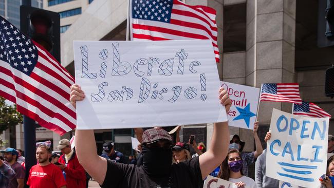 Protesters rally against California’s stay at home order in downtown San Diego on Saturday. Picutre: AFP