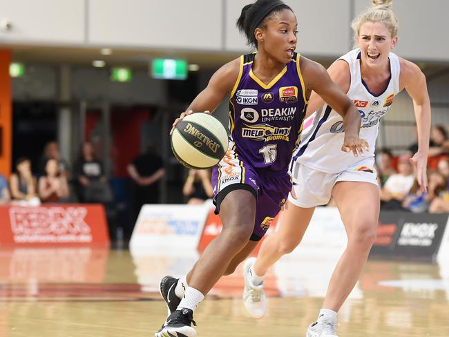 Melbourne Boomers v Adelaide Lightning match at State Basketball Centre, Wantirna Sth, Vic.  Adelaide won 76 to 60.  Lindsay Allen pursued by Lauren Nicholson. Pic: Lawrence Pinder