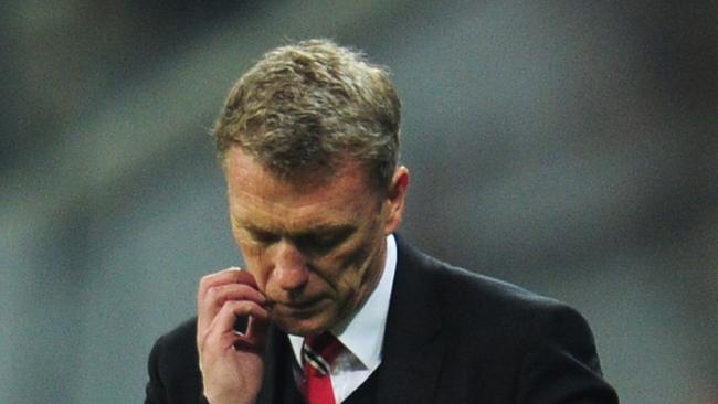 MUNICH, GERMANY - APRIL 09: David Moyes, manager of Manchester United looks dejected during the UEFA Champions League Quarter Final second leg match between FC Bayern Muenchen and Manchester United at Allianz Arena on April 9, 2014 in Munich, Germany. (Photo by Shaun Botterill/Getty Images)