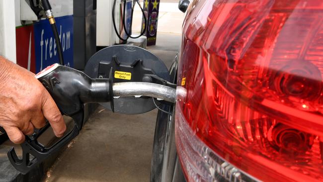 A motorist fuels up at Freedom Fuels in East Bundaberg.