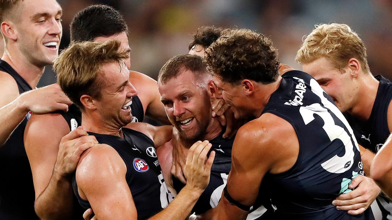 Sam Docherty was swamped by teammates after his round 1 goal. Picture: Dylan Burns/AFL Photos via Getty Images