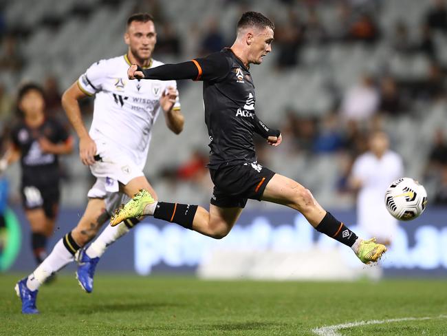 SYDNEY, AUSTRALIA - APRIL 09: Dylan Wenzel-Halls of the Roar attempts to lob the goalkeepr during the A-League match between Macarthur FC and the Brisbane Roar at Campbelltown Stadium, on April 09, 2021, in Sydney, Australia. (Photo by Mark Metcalfe/Getty Images)
