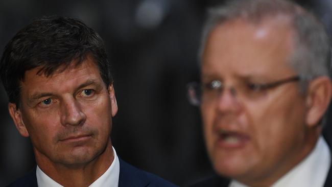 Minister for Energy and Emissions Reduction Angus Taylor listens as Prime Minister Scott Morrison speaks to media earlier this week. Picture: AAP