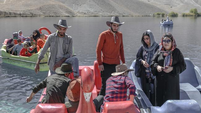 People sit on paddle boats for a ride at the Band-e-Amir lake in the Bamiyan Province in October 2021, two months after the Taliban retook control of Afghaistan. Picture: AFP