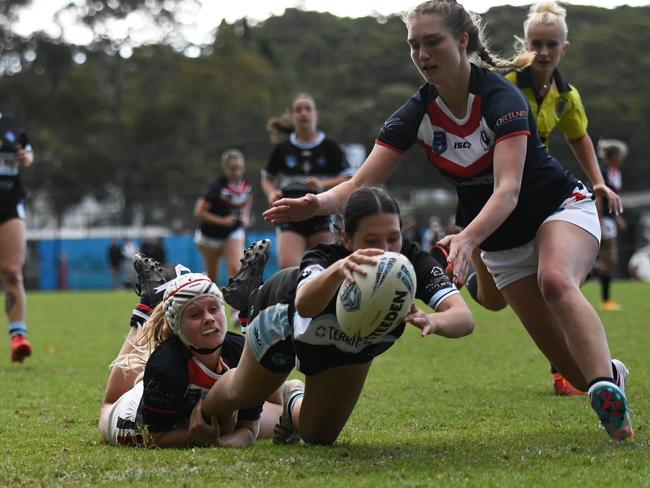 The Terrigal-Wamberal Sharks' women's tackle league team in action against the Erina Eagles during their inaugural game in the Central Coast Rugby League at Erina Oval on May 7, 2023. Photo: Jodie Ward.