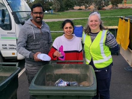 Northern Community Recycling Group’s Ann Williams (right) with Hume residents diverting their recyclables from landfill during the city’s first fortnightly pop-up collection day at Craigieburn.