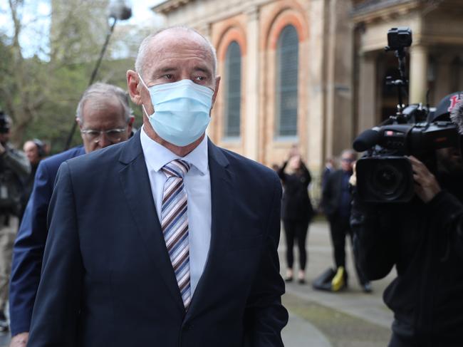 Chris Dawson walking into the NSW Supreme Court in a large media scrum for the last time. Picture: John Grainger