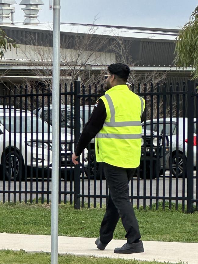 A security guard outside Springside West Secondary College on Friday. Picture: Supplied