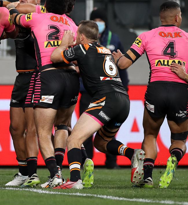 SYDNEY, AUSTRALIA - JULY 04: Joseph Leilua of the Tigers and his teammates scuffle with Panthers players during the round eight NRL match between the Wests Tigers and the Penrith Panthers at Bankwest Stadium on July 04, 2020 in Sydney, Australia. (Photo by Mark Kolbe/Getty Images)