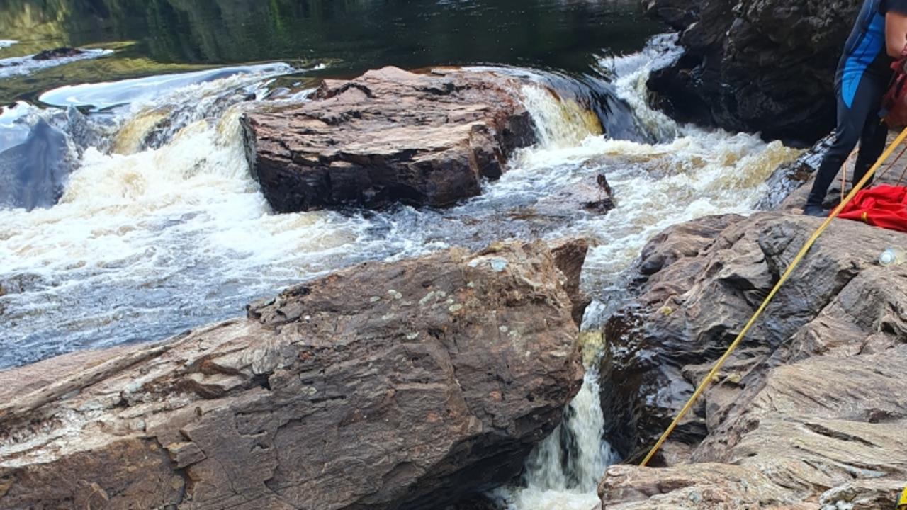 Dozens of police, paramedics, surf life savers, Rotor-Lift and health services worked to free the man for 20-hours after he became trapped between rocks in running water. Pictures: Tasmania Police