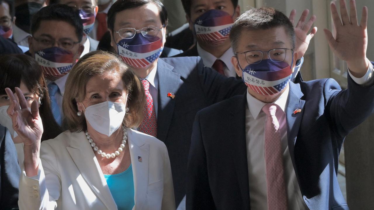 US House Speaker Nancy Pelosi (L) waved to journalists as she arrived at Taiwan’s parliament on Wednesday. Speaking in the chamber, she described Taiwan as “one of the freest societies in the world” (Photo by Sam Yeh / AFP)