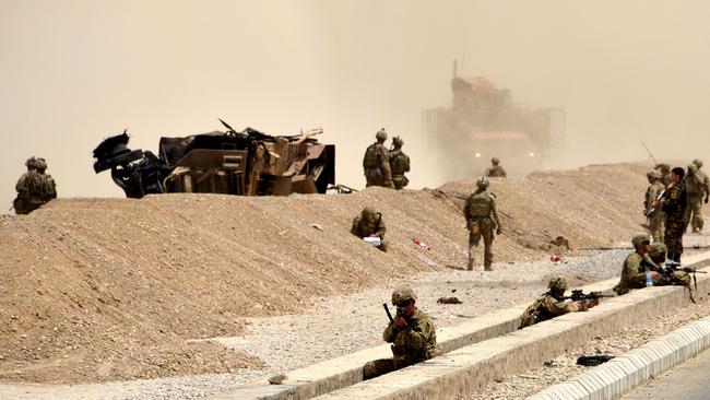 US troops at the site of a Taliban suicide attack near Kandahar in 2017. Picture: AFP