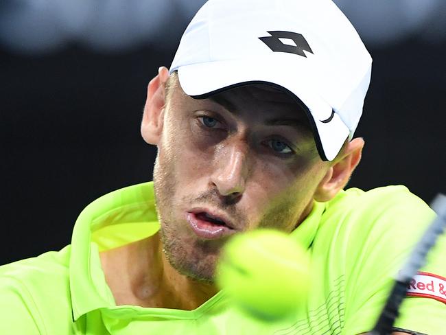 Australian John Millman returns during his first round match against Peter Polansky of Canada at the Brisbane International Tennis Tournament in Brisbane, Tuesday, January 2, 2018. (AAP Image/Dave Hunt) NO ARCHIVING, EDITORIAL USE ONLY