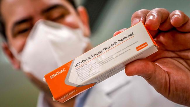 A doctor from Sao Lucas Hospital holds a coronavirus vaccine produced by Sinovac Biotech. Picture: AFP