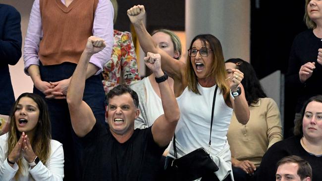 Australian swimming great Hayley Lewis and husband Greg Taylor cheer on son Kai Taylor on Wednesday night. Picture: William WEST / AFP