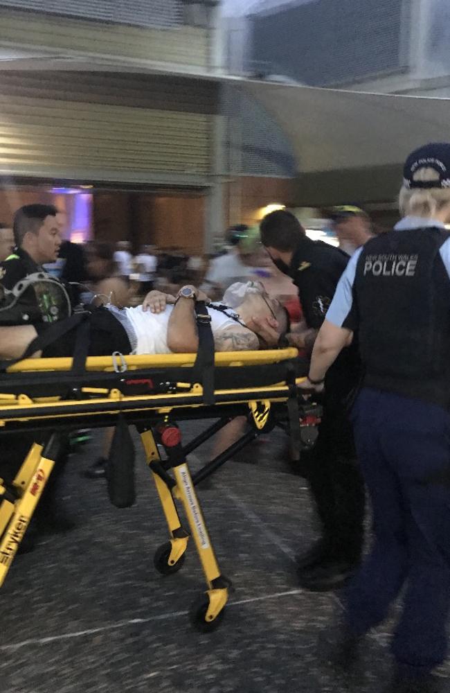 This man was taken away by ambulance and police on a stretcher from HTID at Sydney Olympic Park, Homebush.