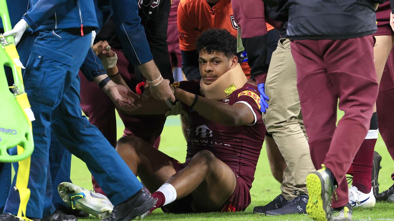 Selwyn Cobbo is tended to by medical staff. Photo: Adam Head