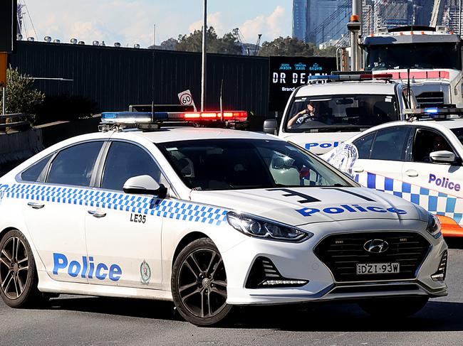 SYDNEY, AUSTRALIA - NewsWire photos JULY 05, 2021: A police car turns around to face the correct direction following NSW Police making a dramatic arrest blocking the West bound fast lane of the A4 City West Link at Lilyfield in Sydney. Picture: NCA NewsWire / Dylan Coker