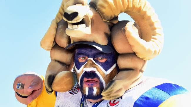 Karl Sides, "The Ram Man", poses whiles tailgating before the start of the game.