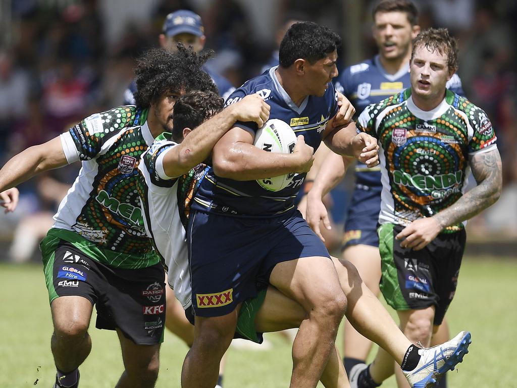 Jason Taumalolo of the Cowboys is tackled during a North Queensland Cowboys Scrimmage against the Townsville Blackhawks. Picture: Ian Hitchcock/Getty Images